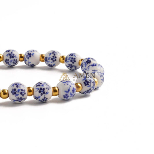 Blue and White Pottery Beads & Baroque Pearl Elastic Cord Cross Bracelet Amen Artisan