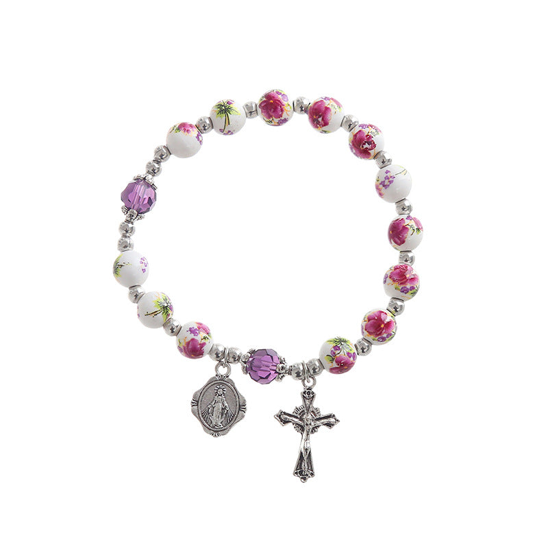 Pulsera artesanal de porcelana azul y blanca con crucifijo y perlas Amen